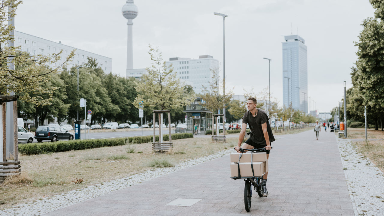 Riding a cargo bike with cardboard boxes in the city